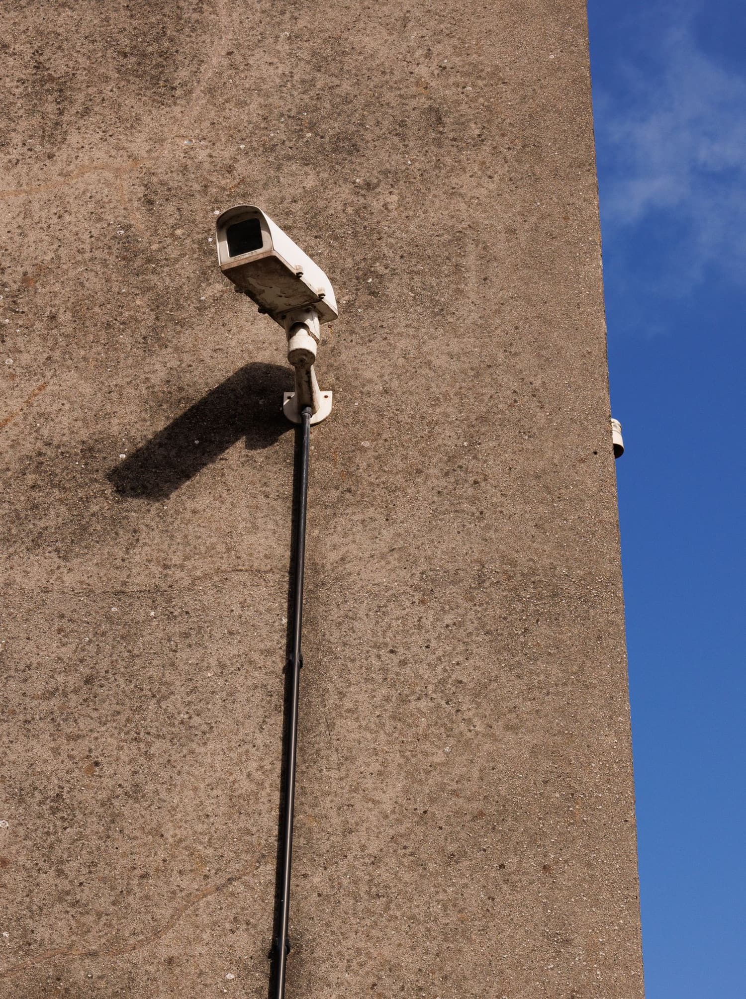 4K security camera mounted under the eave of a Utah home covering the driveway