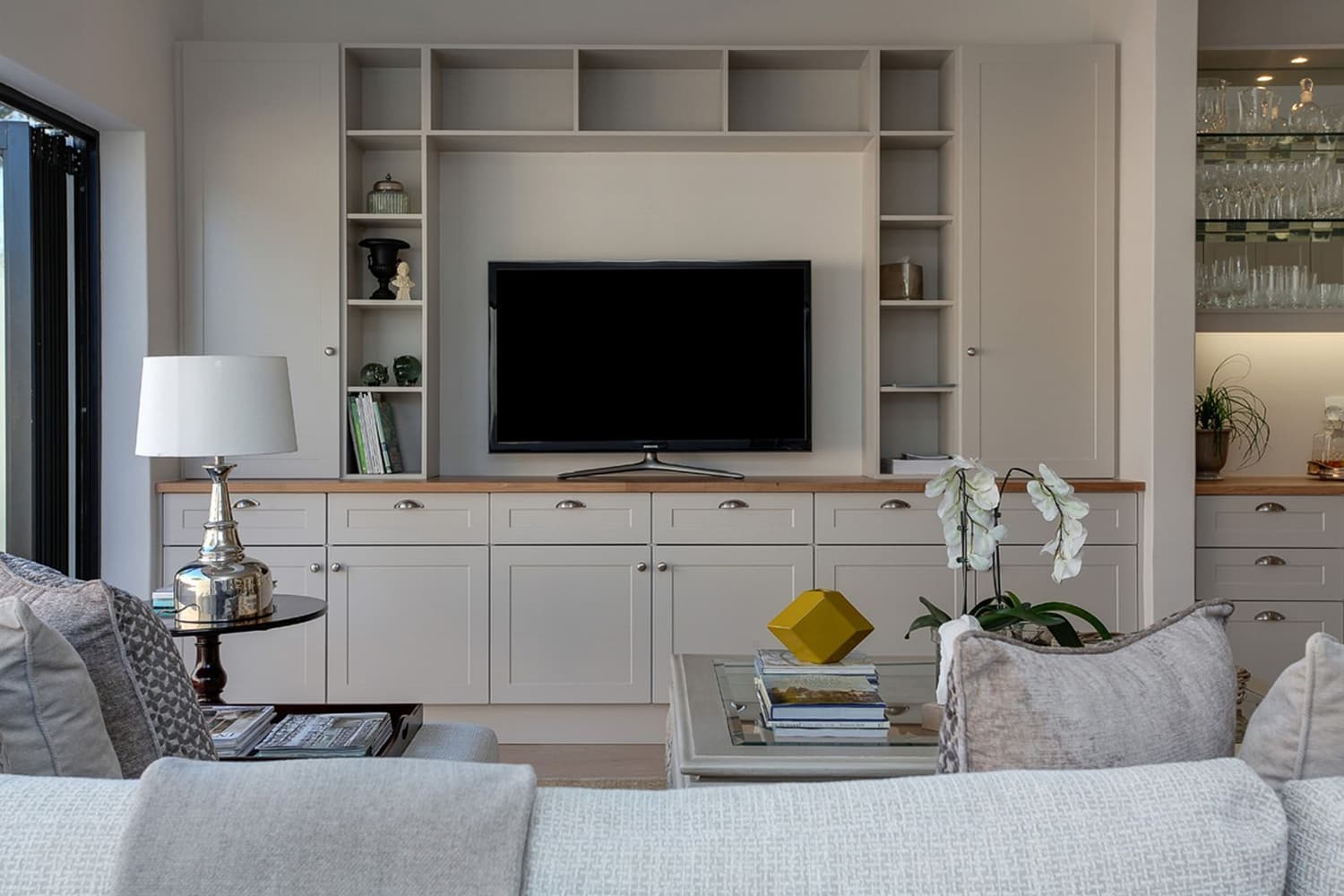 TV mounted over a fireplace with no visible wires in a modern Utah living room